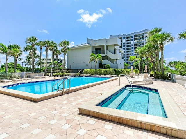 view of swimming pool featuring a patio area