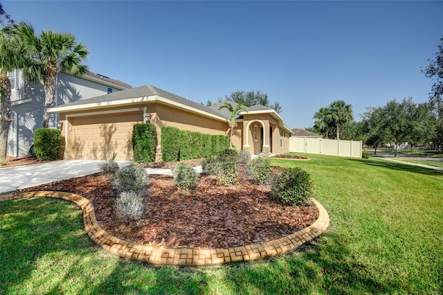 view of front of house with a front yard and a garage