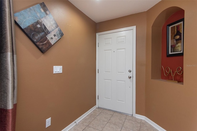 entryway with light tile patterned floors