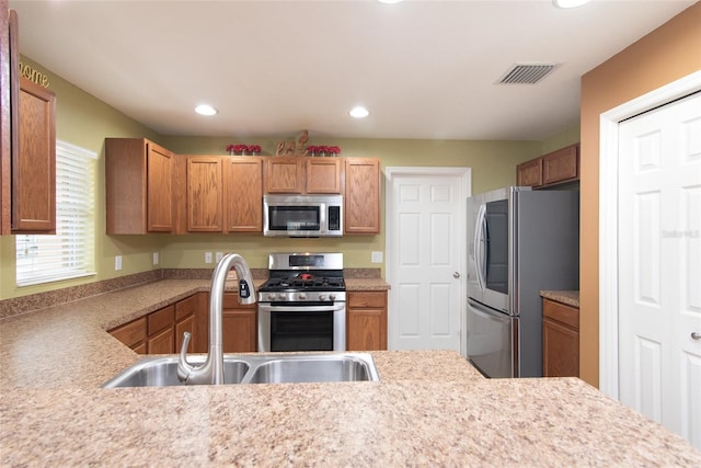 kitchen featuring appliances with stainless steel finishes and sink