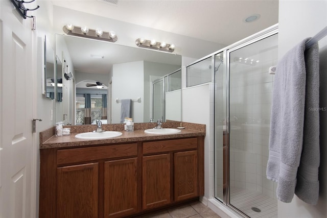 bathroom featuring an enclosed shower, ceiling fan, tile patterned floors, and vanity