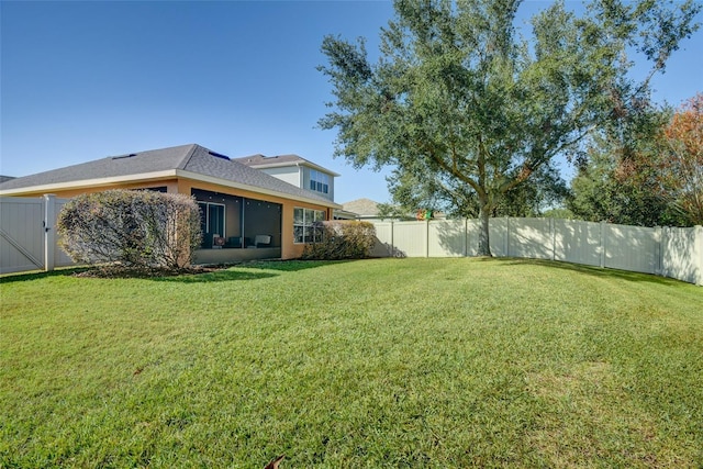 view of yard with a sunroom