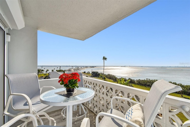 balcony featuring a water view