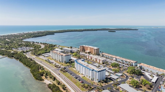 birds eye view of property featuring a view of city and a water view