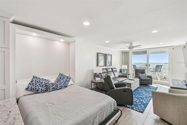 bedroom featuring access to outside, light wood finished floors, a ceiling fan, and recessed lighting