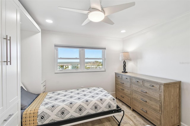 bedroom with ornamental molding, light wood-type flooring, and recessed lighting