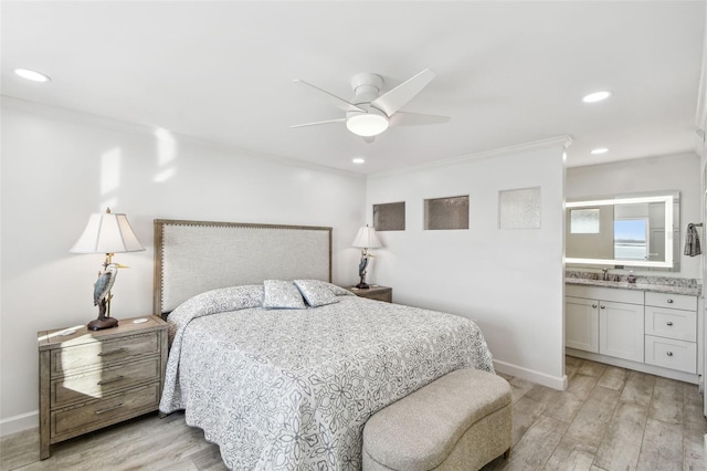 bedroom featuring baseboards, ornamental molding, and light wood-style floors