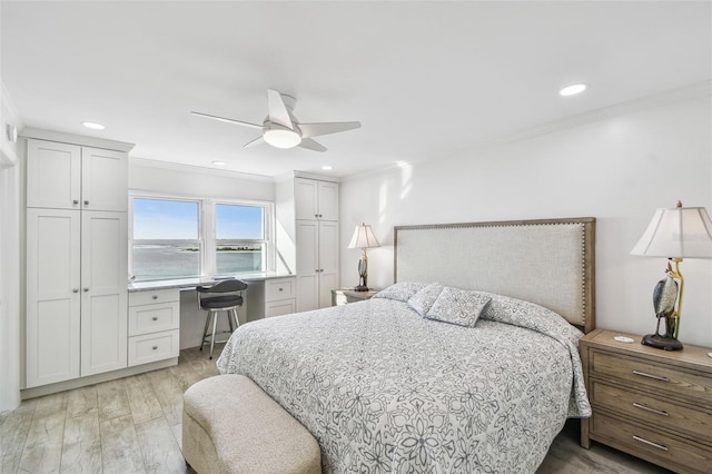 bedroom with ornamental molding, light wood-type flooring, ceiling fan, and recessed lighting