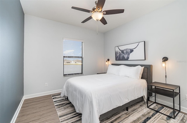 bedroom featuring ceiling fan and hardwood / wood-style flooring