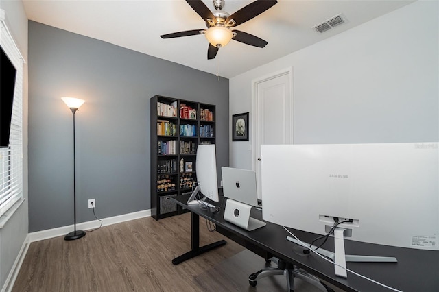 home office featuring hardwood / wood-style flooring and ceiling fan