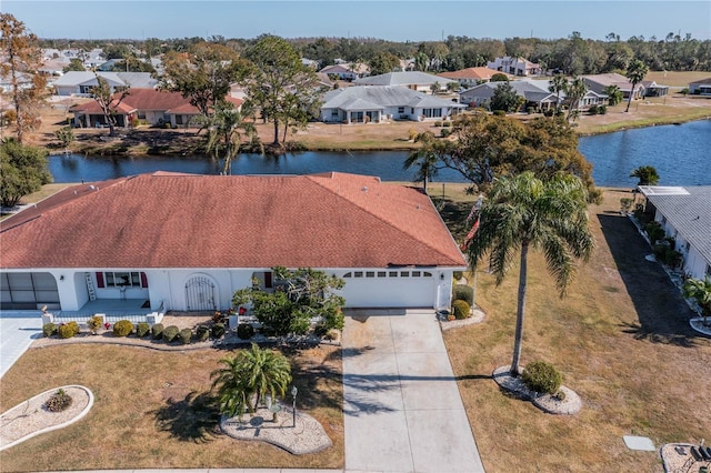 birds eye view of property with a water view