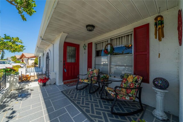 view of patio featuring a porch