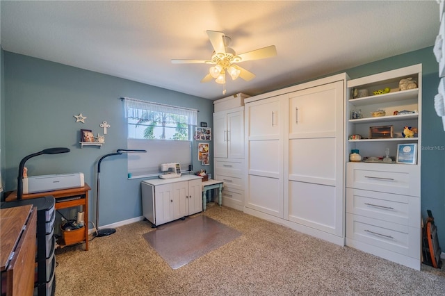 carpeted office with ceiling fan