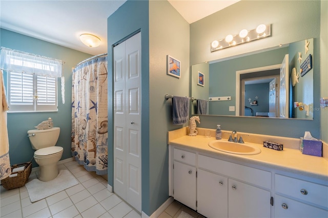 bathroom with tile patterned floors, toilet, and vanity