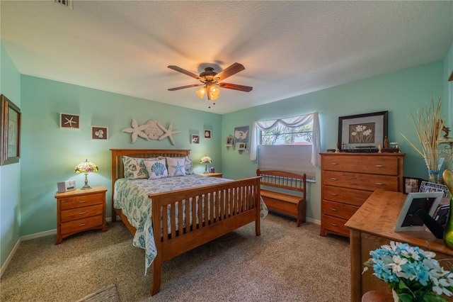 bedroom with carpet floors, a textured ceiling, and ceiling fan