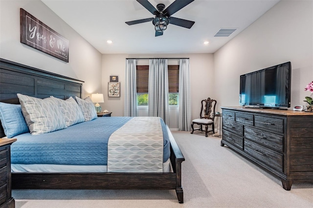 bedroom with ceiling fan and light carpet