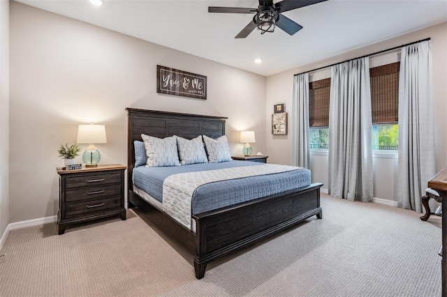 bedroom with ceiling fan and light colored carpet