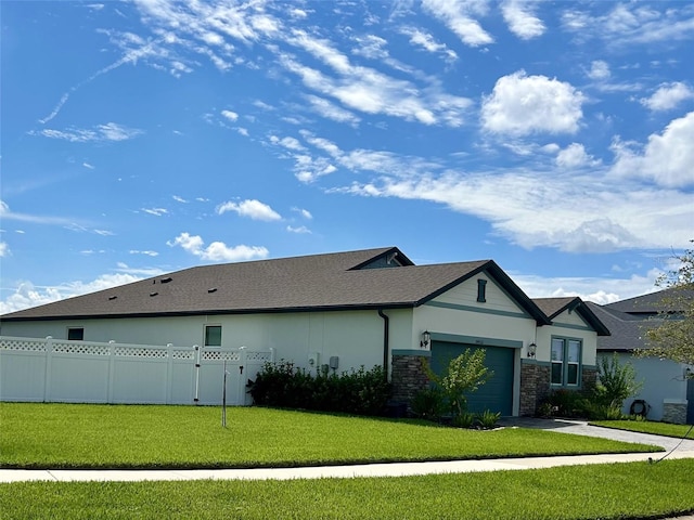 view of home's exterior featuring a yard and a garage