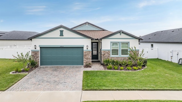 view of front facade featuring a front yard and a garage