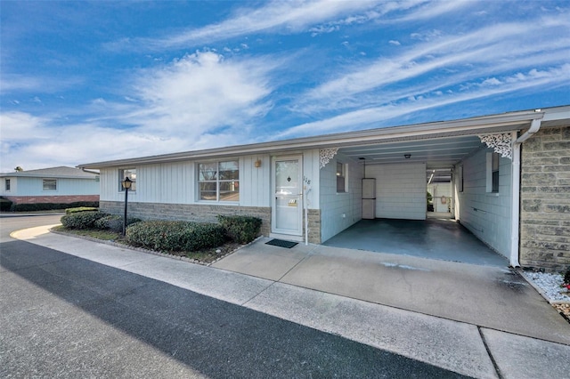 single story home featuring a carport