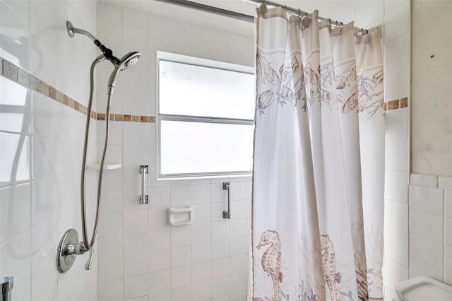 bathroom with a wealth of natural light and walk in shower