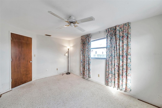 spare room with ceiling fan