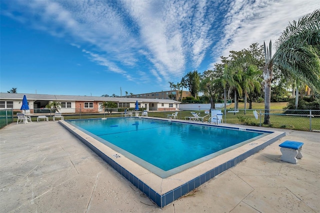 view of swimming pool featuring a patio area