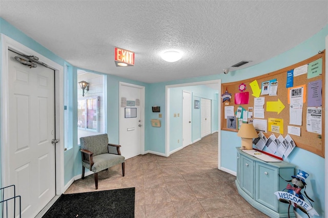 interior space with a textured ceiling