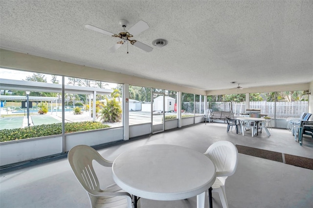 sunroom / solarium with ceiling fan