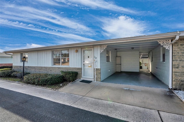 ranch-style home with a carport