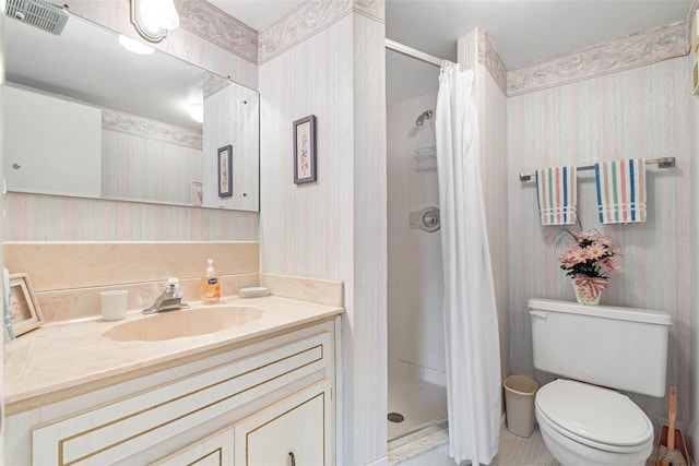 bathroom with walk in shower, vanity, and toilet