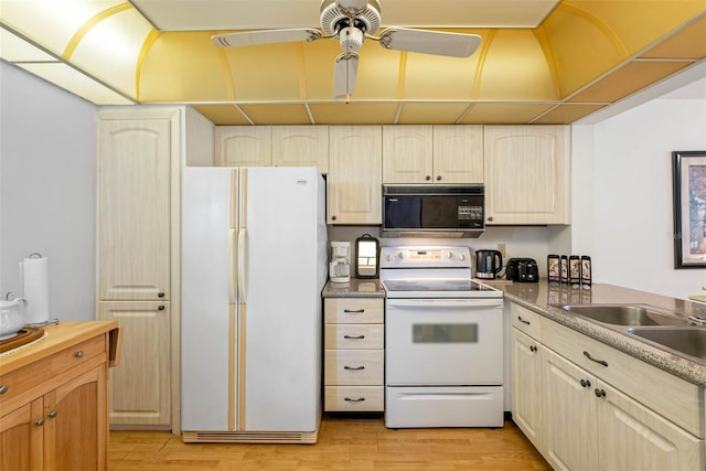 kitchen featuring sink, white appliances, light wood-type flooring, and ceiling fan