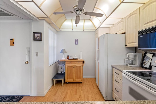 kitchen with ceiling fan, white electric range oven, light brown cabinetry, and light wood-type flooring