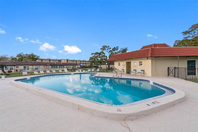 view of swimming pool with a patio