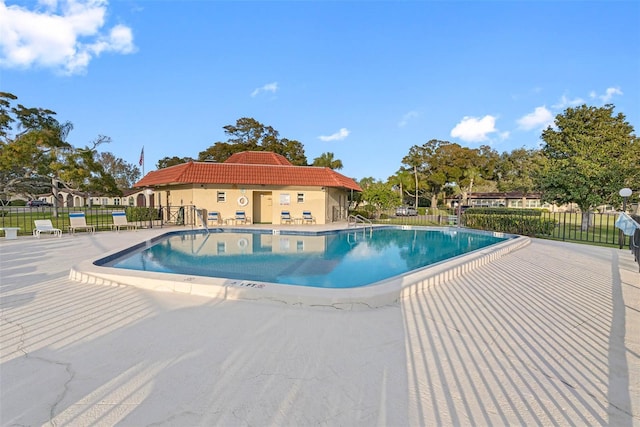 view of swimming pool with a patio area