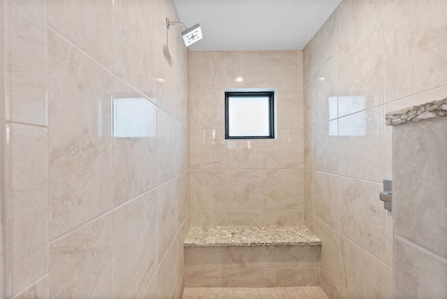 bathroom featuring tiled shower