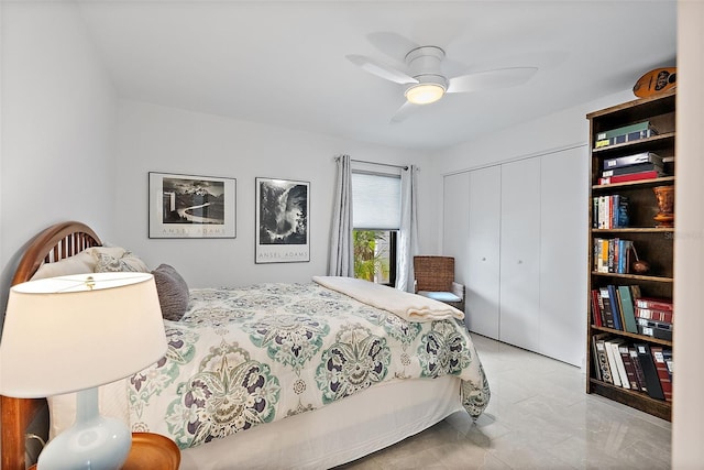 bedroom with ceiling fan and a closet