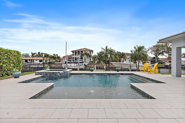 view of pool featuring an in ground hot tub and a patio area