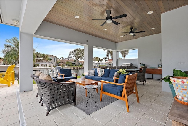 view of patio with ceiling fan and an outdoor living space