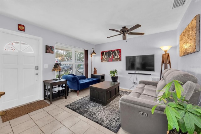 tiled living room featuring ceiling fan