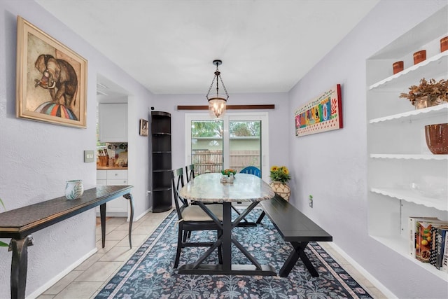 dining area featuring light tile patterned floors