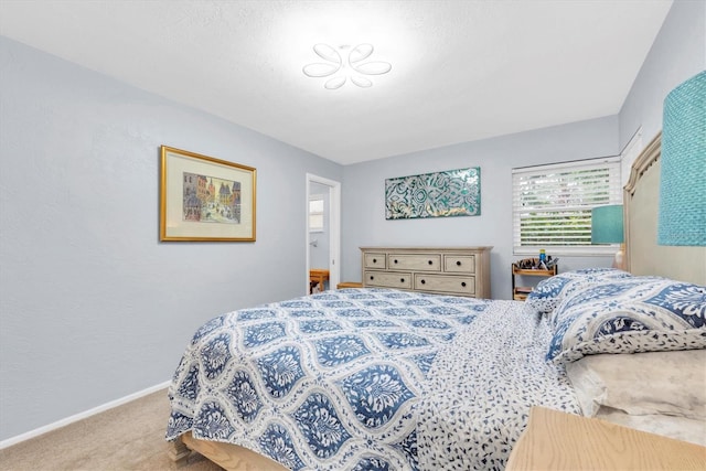 bedroom with light colored carpet