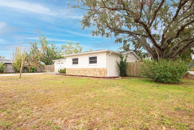 view of home's exterior with a yard