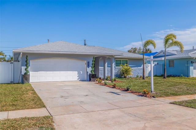 single story home with a front lawn and a garage