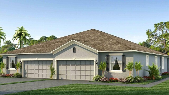 view of front of home featuring a front yard and a garage