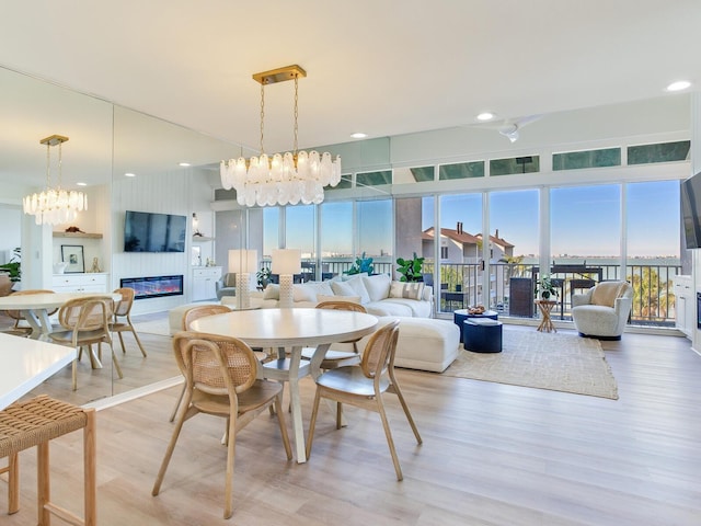 dining room featuring hardwood / wood-style flooring and a notable chandelier