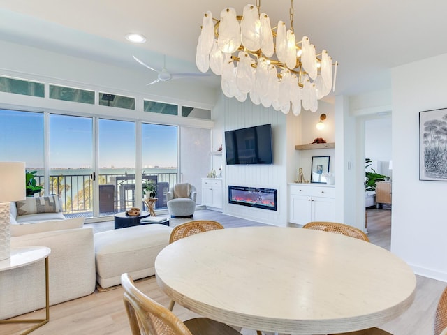 dining room with a chandelier and light hardwood / wood-style flooring