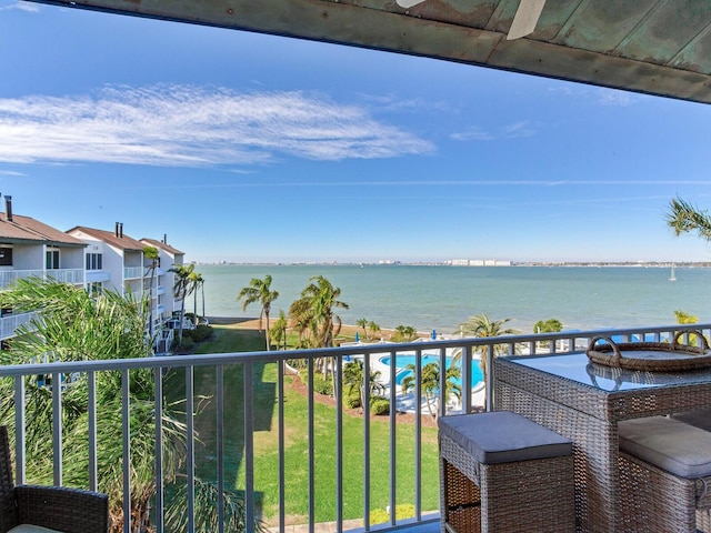 balcony featuring a water view