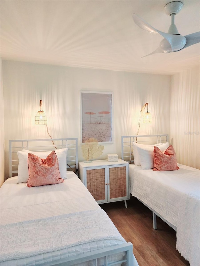 bedroom with dark wood-type flooring and ceiling fan