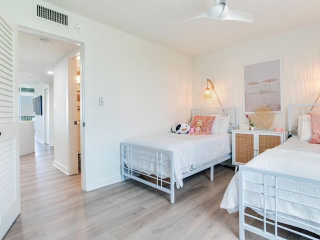 bedroom featuring ceiling fan and light hardwood / wood-style flooring